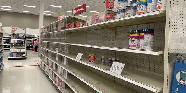 Major retailers such as Target, Walmart, Walgreens and CVS have limited the purchases of formula in some cases, yet many parents are panic-buying. In this May 2022 photo, a Target in Long Island, N.Y., shows empty formula shelves. 