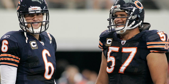 Chicago Bears quarterback Jay Cutler and center Olin Kreutz share a laugh near the end of their game against the Dallas Cowboys at Cowboys Stadium in Arlington, Texas, Sunday, Sept. 19, 2010.