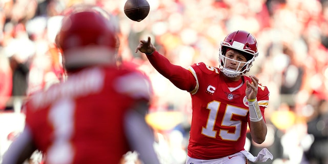 Kansas City Chiefs quarterback Patrick Mahomes (15) throws a pass to running back Jerick McKinnon (1) during the first half of the AFC championship game against the Cincinnati Bengals Jan. 30, 2022, in Kansas City, Mo.