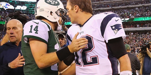 New York's Ryan Fitzpatrick meets Tom Brady of the New England Patriots after the Jets' 26-20 overtime win at MetLife Stadium on Dec. 27, 2015, in East Rutherford, New Jersey.