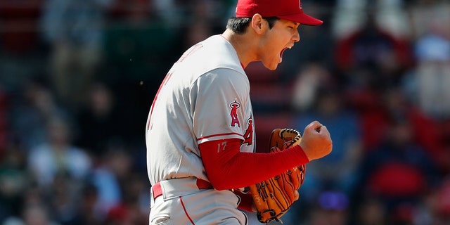 Los Angeles Angels' Shohei Ohtani reacts after striking out Boston Red Sox's Trevor Story during the seventh inning of a baseball game, Thursday, May 5, 2022, in Boston. 