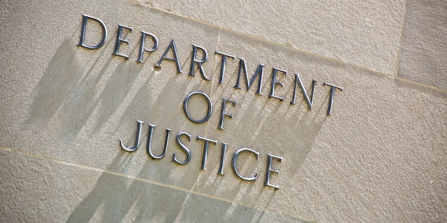 The entrance signage for the United States Department of Justice Building in Washington DC, USA. The Department of Justice, the U.S. law enforcement and administration of Justice government agency.