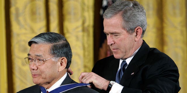 President Bush awards the Presidential Medal of Freedom to former Transportation Secretary Norman Y. Mineta during a ceremony at the White House on Dec. 15, 2006.