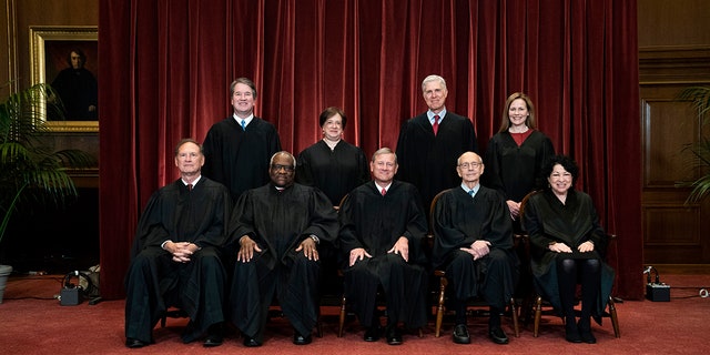 Seated from left are Associate Justice Samuel Alito, Associate Justice Clarence Thomas, Chief Justice John Roberts, Associate Justice Stephen Breyer and Associate Justice Sonia Sotomayor, Standing from left are Associate Justice Brett Kavanaugh, Associate Justice Elena Kagan, Associate Justice Neil Gorsuch and Associate Justice Amy Coney Barrett. 