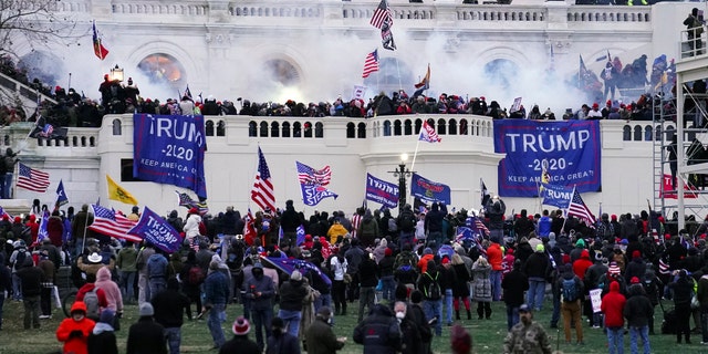 Rioters storm the Capitol in Washington on Jan. 6, 2021. (AP Photo/John Minchillo, File)