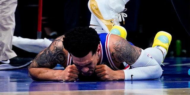 Philadelphia 76ers' Danny Green lays injured on the ground during the first half of Game 6 of an NBA basketball second-round playoff series against the Miami Heat, Thursday, May 12, 2022, in Philadelphia.