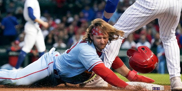 Brendan Donovan #33 of the St. Louis Cardinals steals third base against Patrick Wisdom #16 of the Chicago Cubs during the fourth inning of Game Two of a doubleheader at Wrigley Field on June 04, 2022 in Chicago, Illinois.