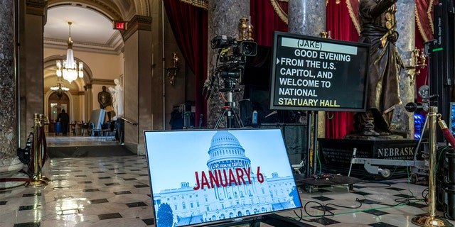 A year after the Jan. 6 attack on the Capitol, television cameras and video monitors fill Statuary Hall in preparation for news coverage, on Capitol Hill in Washington, Wednesday, Jan. 5, 2022.