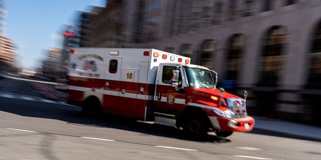 An ambulance drives through Washington, DC, on February 5, 2022. 