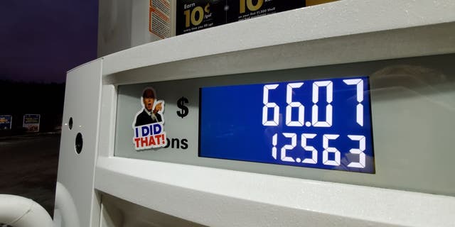 A caricature sticker of President Joe Biden pointing to high gas prices on a gasoline pump is visible in Lafayette, California, November 9, 2021. Photo courtesy Sftm. (Photo by Gado/Getty Images)