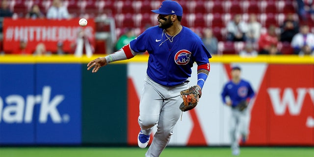 CINCINNATI, OH - MAY 23:  Jonathan Villar #24 of the Chicago Cubs flips the ball to a teammate after making a play at second base and ending the inning during the game against the Cincinnati Reds at Great American Ball Park on May 23, 2022 in Cincinnati, Ohio. Chicago defeated Cincinnati 7-4. 