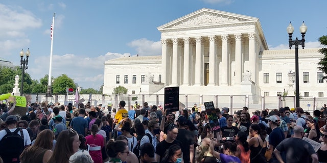Demonstrators gather outside the Supreme Court on June 24.
