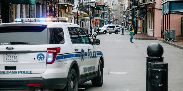 Police vehicles block access to Bourbon Street in New Orleans, Louisiana, Tuesday, Feb. 16, 2021. (Bryan Tarnowski/Bloomberg via Getty Images)