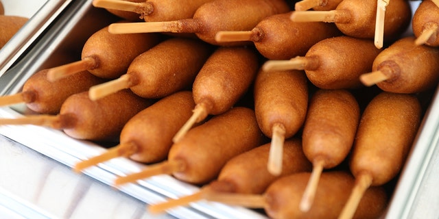 Corn dogs are ready to be eaten during the American Meat Institute's annual Hot Dog Lunch in the Rayburn courtyard on July 19, 2017, in Washington, D.C. The hot dog lunch held during National Hot Dog month has been celebrated for decades in Washington.
