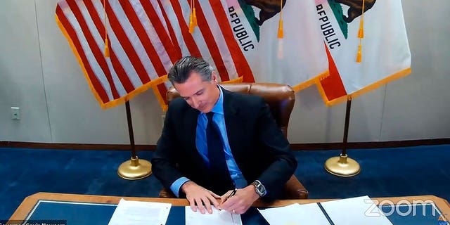  California Gov. Gavin Newsom signing into law a bill that establishes a task force to come up with recommendations on how to give reparations to Black Americans 