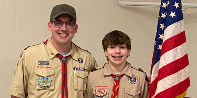 Boy Scout Eli Skrypczak (at right) of Wisconsin, who is 15, along with his father, Dan Skrypczak, who is a Boy Scout troop leader. 