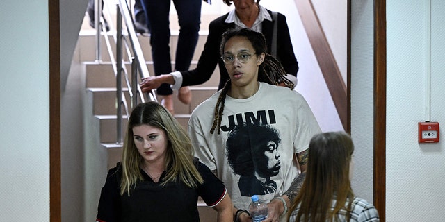 WNBA basketball star Brittney Griner, center, arrives to a hearing at the Khimki Court outside Moscow July 1, 2022.