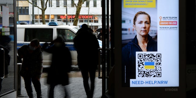 A digital information board warns female refugees from Ukraine, amid Russia's invasion, at the central station of Duesseldorf, Germany March 31, 2022. The board reads "victim of violence or human trafficking?"