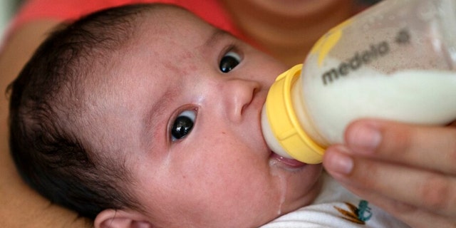 An infant is given a bottle of formula. It's not only babies that need access to formula, a trade association spokesperson told Fox News Digital.