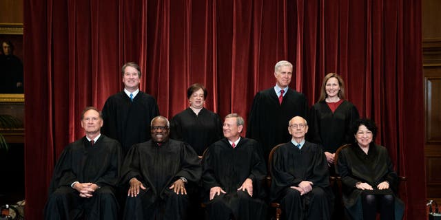 Members of the Supreme Court pose for a group photo at the Supreme Court in Washington, D.C. April 23, 2021. Seated from left: Associate Justice Samuel Alito, Associate Justice Clarence Thomas, Chief Justice John Roberts, Associate Justice Stephen Breyer and Associate Justice Sonia Sotomayor, Standing from left: Associate Justice Brett Kavanaugh, Associate Justice Elena Kagan, Associate Justice Neil Gorsuch and Associate Justice Amy Coney Barrett. 