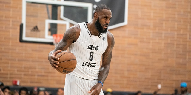 LeBron James handles the ball at the Drew League pro-am July 16, 2022, in Los Angeles.