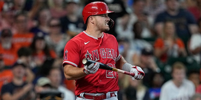 Los Angeles Angels' Mike Trout reacts after striking out against the Houston Astros during the third inning of a baseball game Sunday, July 3, 2022, in Houston. 