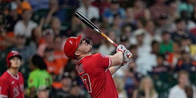 Los Angeles Angels' Mike Trout pops out against the Houston Astros during the seventh inning of a baseball game Sunday, July 3, 2022, in Houston. 