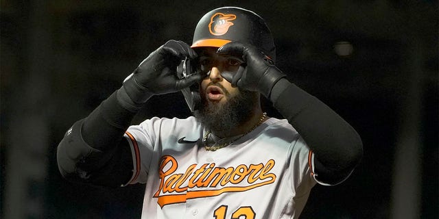 Baltimore Orioles' Rougned Odor gestures to teammates after hitting an RBI single against the Chicago Cubs during the eighth inning of a baseball game Wednesday, July 13, 2022, in Chicago. 