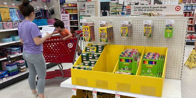 A parent shops for school supplies at a Target store, on Wednesday, July 27, 2022, in North Miami, Fla. 