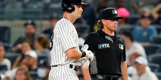 The New York Yankees' Andrew Benintendi reacts after hitting a fly out during the ninth inning of a game against the Kansas City Royals July 28, 2022, in New York.  