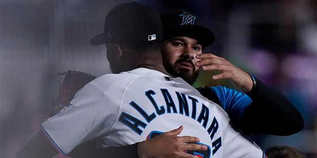 Miami Marlins starting pitcher Sandy Alcantara (22) is congratulated by Pablo Lopez after the Marlins beat the Cincinnati Reds 3-0 in a baseball game, Wednesday, Aug. 3, 2022, in Miami. 