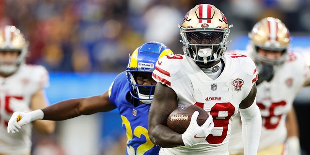 Deebo Samuel (19) of the San Francisco 49ers runs after a catch for a touchdown against the Los Angeles Rams in the NFC championship game at SoFi Stadium Jan. 30, 2022, in Inglewood, Calif.