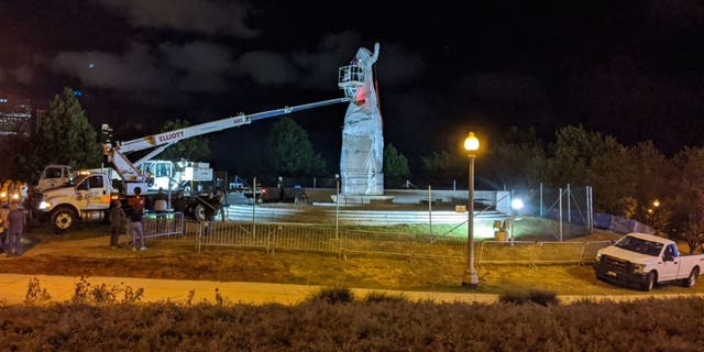 A statue of Christopher Columbus at Grant Park in Chicago is removed early on July 24, 2020.