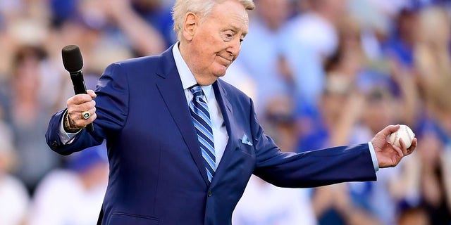 Former Los Angeles Dodgers broadcaster Vin Scully speaks to fans before Game 2 of the 2017 World Series between the Houston Astros and the Los Angeles Dodgers at Dodger Stadium, Oct. 25, 2017, in Los Angeles, California.