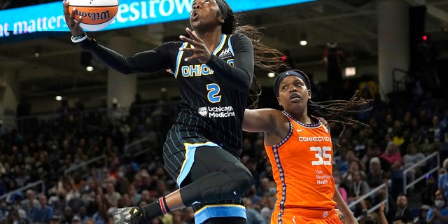 Chicago Sky's Kahleah Copper drives to the basket past Connecticut Sun's Jonquel Jones during the second half in Game 1 of a WNBA basketball semifinal playoff series Sunday, Aug. 28, 2022, in Chicago. The Sun won 68-63.
