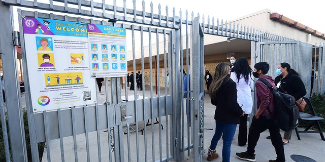 Students return to campus at Olive Vista Middle School on the first day back following the winter break amid a dramatic surge in COVID-19 cases across Los Angeles County Jan. 11, 2022 in Sylmar, Calif.