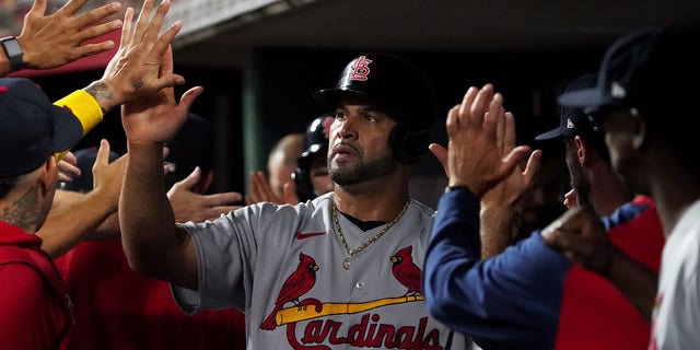 Albert Pujols #5 of the St. Louis Cardinals celebrates scoring a run in the second inning against the Cincinnati Reds at Great American Ball Park on August 29, 2022 in Cincinnati, Ohio.