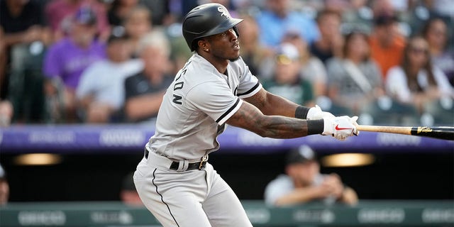 Chicago White Sox's Tim Anderson follows the flight of his double off Colorado Rockies starting pitcher German Marquez in the third inning of a baseball game Tuesday, July 26, 2022, in Denver. 