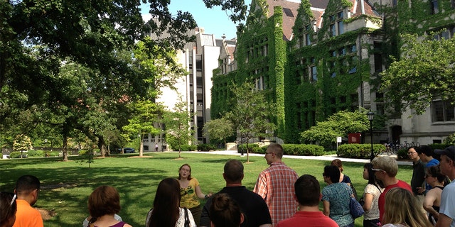 Prospective college students take a tour of the University of Chicago campus.