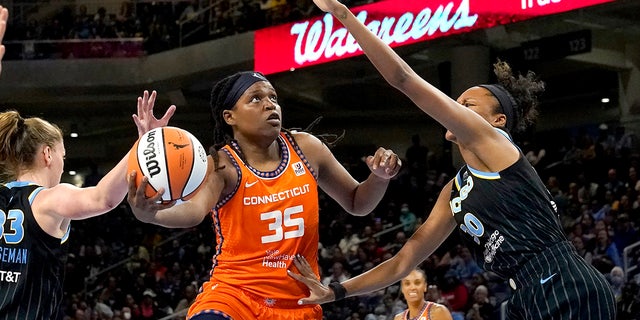 Connecticut Sun's Jonquel Jones (35) shoots as Chicago Sky's Azura Stevens defends during the first half in Game 1 of a WNBA basketball semifinal playoff series Sunday, Aug. 28, 2022, in Chicago.