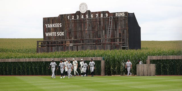 Members of the Chicago White Sox and the New York Yankees take the field prior to a game at the Field of Dreams on Aug. 12, 2021, in Dyersville, Iowa.