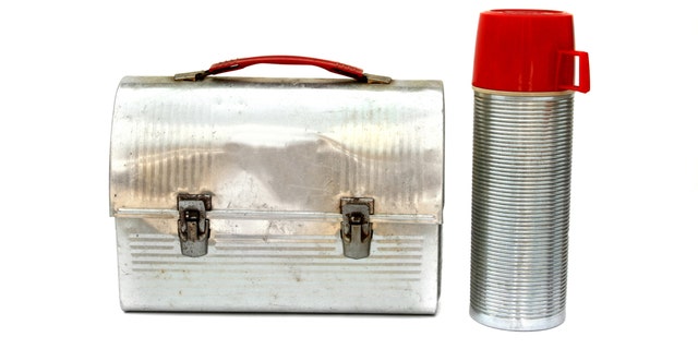 Seen in this photo is a vintage metal lunch box and Thermos.
