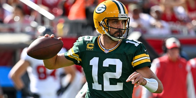 Green Bay Packers' Aaron Rodgers throws during the first half of an NFL football game against the Tampa Bay Buccaneers Sunday, Sept. 25, 2022, in Tampa, Florida. 