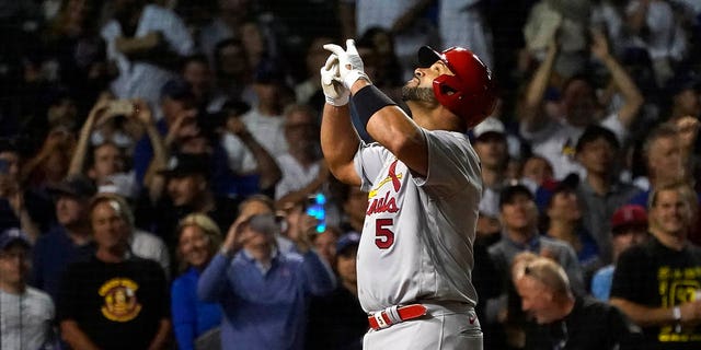 St. Louis Cardinals' Albert Pujols celebrates his 693rd career home run off Chicago Cubs starting pitcher Drew Smyly during the seventh inning of a baseball game Monday, Aug. 22, 2022, in Chicago.