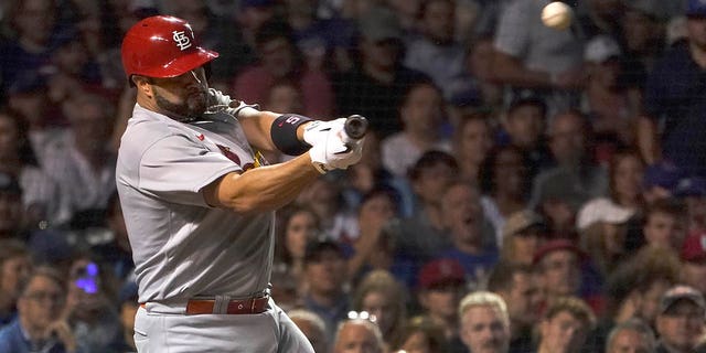 St. Louis Cardinals' Albert Pujols hits his 693rd career home run off Chicago Cubs starting pitcher Drew Smyly during the seventh inning of a baseball game Monday, Aug. 22, 2022, in Chicago.