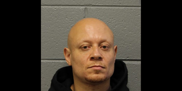 Brian Crowder, 40, is facing a felony charge for an alleged sexual relationship with a teen when he was dean of a Chicago high school (Chicago Police Department)