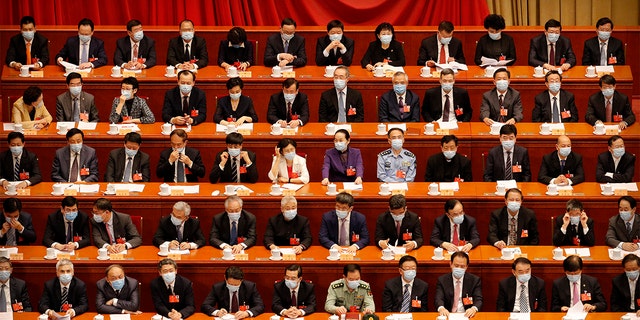 Delegates wear face masks for the opening session of the Chinese People's Political Consultative Conference at the Great Hall of the People in Beijing, May 21, 2020.