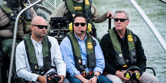 Rep. Tony Gonzales, R-Texas, center, and House Minority Leader Kevin McCarthy, R-Calif., ride a U.S. Border Patrol air boat on a tour of the U.S.-Mexico border on Monday, April 25, 2022 in Eagle Pass, TX. 