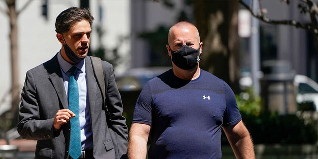 James Theodore Highhouse, right, arrives to his hearing at the U.S. District Court with attorney Jaime Dorenbaum, left, in Oakland, California, on Aug. 31, 2022. Highhouse pleaded guilty in February for sexually abusing inmates. 