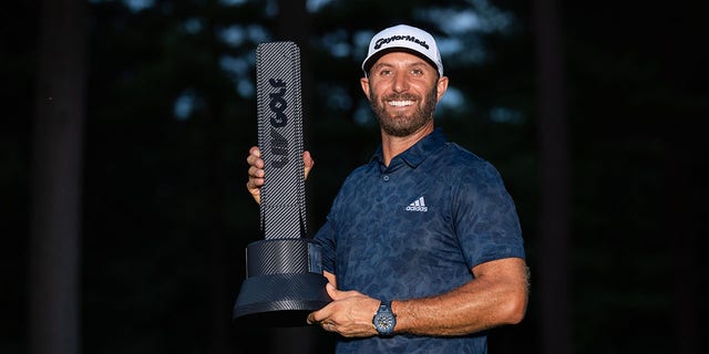 Dustin Johnson of the 4 Aces GC poses with his trophy after the final round of the LIV Golf Invitational-Boston at The Oaks course at The International in Bolton, Massachusetts, on Sept. 4, 2022.